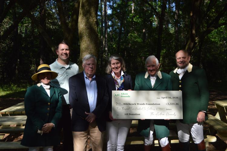 group giving check to foundation